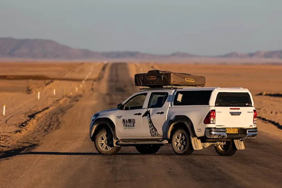 Rear view of Namib Trails 4x4 Toyota Hilux on gravel track
