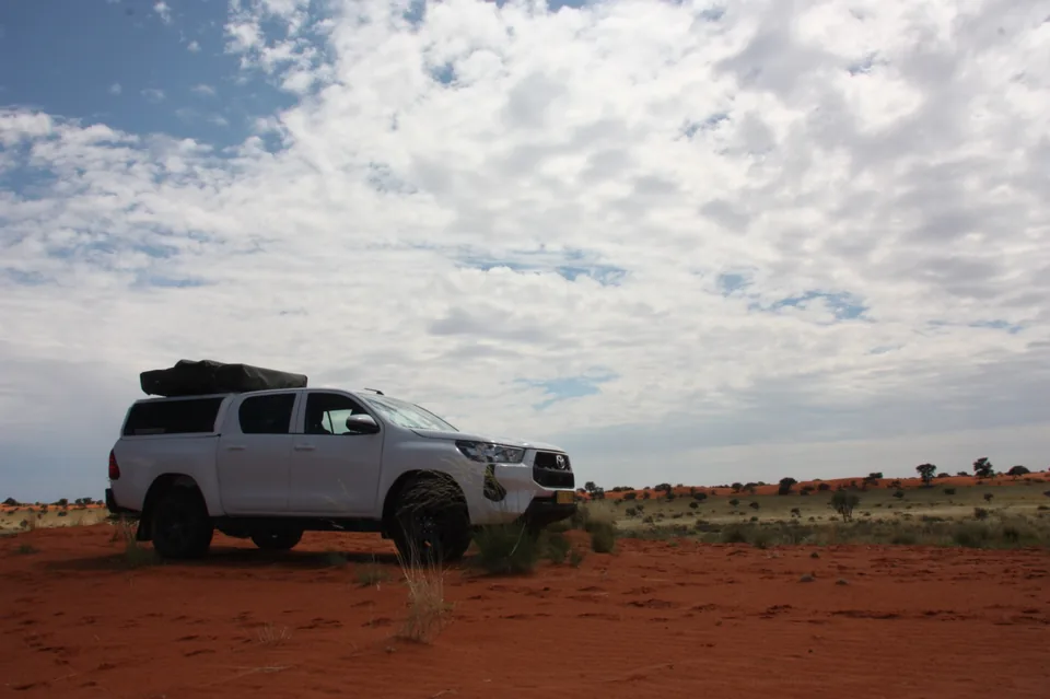 Namib Trails 4x4 Toyota Hilux on a long straight Namibian road