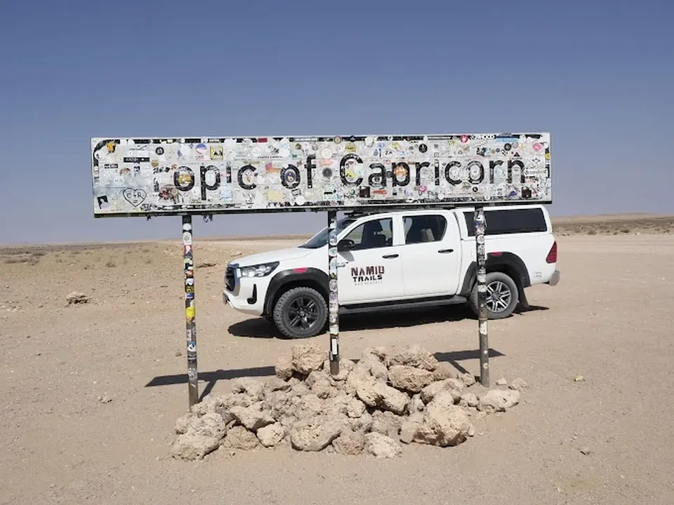 Namib Trails 4x4 Toyota Hilux on open desert plain under wide sky