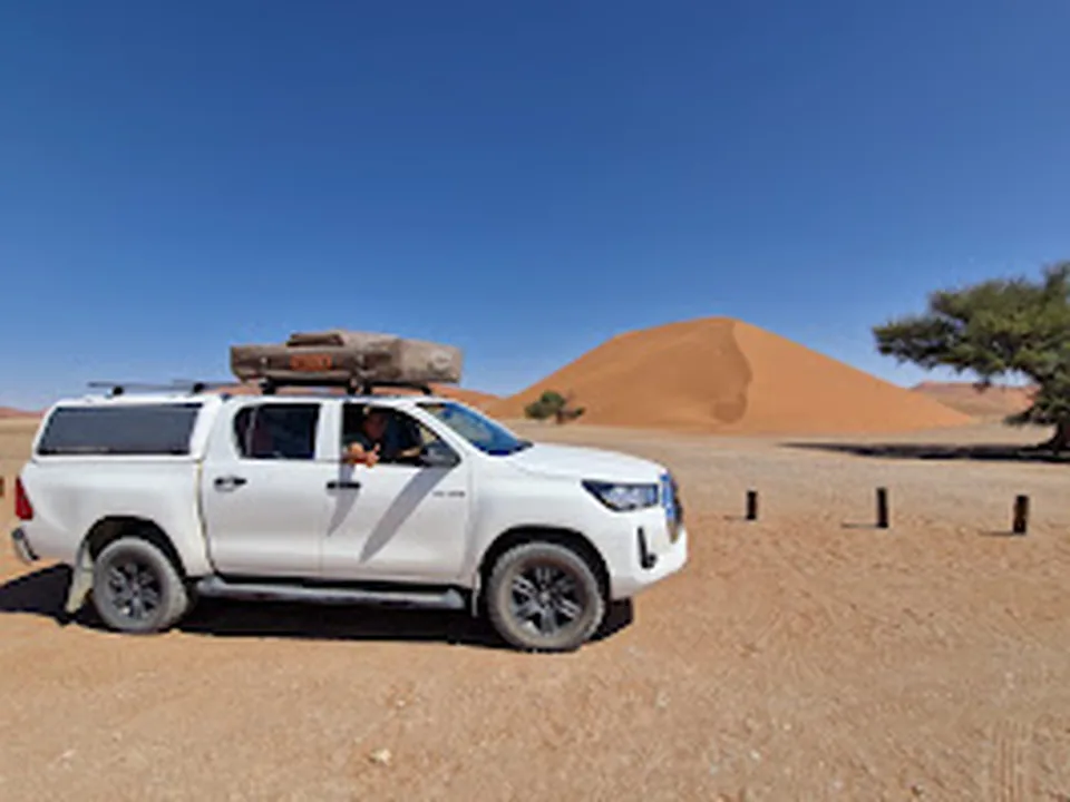 Side view of Namib Trails 4x4 Toyota Hilux with rooftop tent